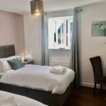 Both rooms can be arranged with single beds